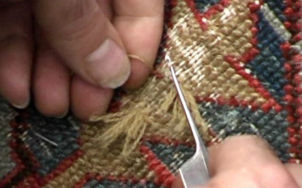 Persian Wool is painstakingly woven into the existing warp and weft matching the color, pattern and weave.