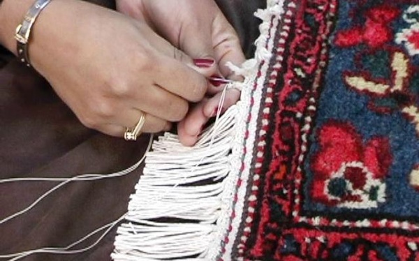 New Cotton is being woven into the existing fringes by hand