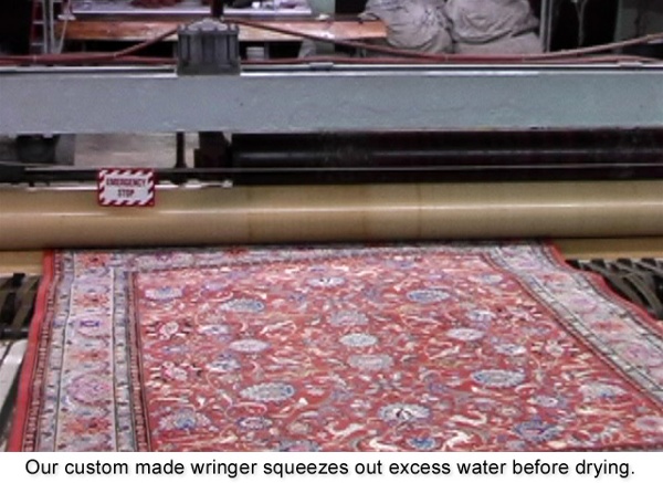 Our custom-made wringer squeezes out the excess water before the drying process.