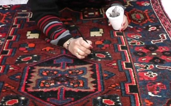 Worn areas and white knots can be colored to blend in with the other colors of the rug.